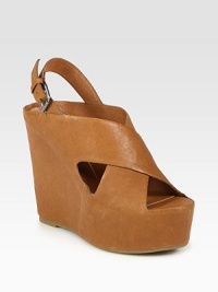 Leather wedge style with wide criss-cross straps and an adjustable slingback. Self-covered wedge, 5 (125mm)Covered platform, 2 (50mm)Compares to a 3 heel (75mm)Leather upperLeather liningRubber solePadded insoleImportedOUR FIT MODEL RECOMMENDS ordering one half size up as this style runs small. Leather wedge style with wide criss-cross straps and an adjustable slingback. Self-covered wedge, 5 (125mm)Covered platform, 2 (50mm)Compares to a 3 heel (75mm)Leather upperLeather liningRubber solePadded insoleImportedOUR FIT MODEL RECOMMENDS ordering one half size up as this style runs small.