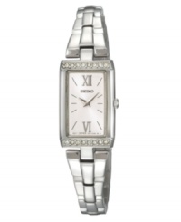 Make a striking impression with this timeless design by Seiko. Watch crafted of stainless steel bracelet and baguette-shaped case. Bezel crystallized with Swarovski elements at top and bottom. Silver tone dial features applied silver tone Roman numerals at twelve and six o'clock, stick indices, two hands and logo. Quartz movement. Water resistant to 30 meters. Three-year limited warranty. Make a striking impression with this timeless design by Seiko. Watch crafted of stainless steel bracelet and baguette-shaped case. Bezel crystallized with Swarovski elements at top and bottom. Silver tone dial features applied silver tone Roman numerals at twelve and six o'clock, stick indices, two hands and logo. Quartz movement. Water resistant to 30 meters. Three-year limited warranty.