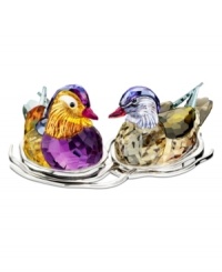 A striking pair, the Topaz Mandarin duck figurines nest together in a bed of silvertone metal. Exquisite faceted detail and vibrant colors in Swarovski crystal capture the natural beautiful of the real birds. A striking pair, the Topaz Mandarin duck figurines nest together in a bed of silvertone metal. Exquisite faceted detail and vibrant colors in Swarovski crystal capture the natural beautiful of the real birds.