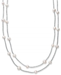 True treasures of the deep. Cultured freshwater pearls (8-10 mm) make a strong statement upon intricately woven silver tone polyester thread. Necklace is long enough to wrap twice for added volume. Approximate length: 64 inches.
