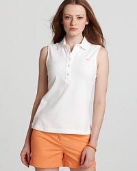 A summer style essential, this Vineyard Vines polo shirt is the perfect partner for this season's printed shorts and color-pop pants. A summer style essential, this Vineyard Vines polo shirt is the perfect partner for this season's printed shorts and color-pop pants.