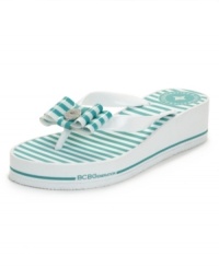 A fun twist on your summer shoes. The Fancie flip flops by BCBGeneration mix it up with stripes, bows and a wedge heel. A fun twist on your summer shoes. The Fancie flip flops by BCBGeneration mix it up with stripes, bows and a wedge heel.