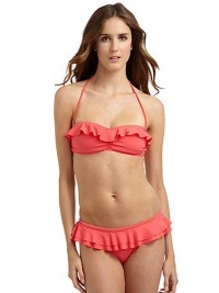 THE LOOKRemovable, adjustable halter strapsRuffles along the bandeau topSide boningRuched centerLogo-embossed button at sideBack clasp closureTHE MATERIAL80% nylon/20% spandexFully linedCARE & ORIGINHand washImportedPlease note: Bikini bottom sold separately. THE LOOKRemovable, adjustable halter strapsRuffles along the bandeau topSide boningRuched centerLogo-embossed button at sideBack clasp closureTHE MATERIAL80% nylon/20% spandexFully linedCARE & ORIGINHand washImportedPlease note: Bikini bottom sold separately.