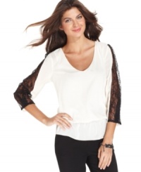 ECI contrasts colors and textures for this striking top, adorned with sheer black lace sleeves and a flattering blouson silhouette. (Clearance) ECI contrasts colors and textures for this striking top, adorned with sheer black lace sleeves and a flattering blouson silhouette. (Clearance)