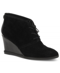 Streamlined appeal. Etienne Aigner's Zita single sole booties feature a subtle lace-up closure and a wedge heel.