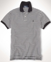 A classic-fitting short-sleeved polo shirt is crafted from breathable cotton mesh with a sleek striped pattern for casual polish. A classic-fitting short-sleeved polo shirt is crafted from breathable cotton mesh with a sleek striped pattern for casual polish.