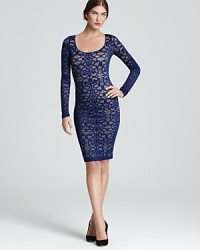 In swirling lace, BCBGMAXAZRIA's form-fitting sheath dress goes bold in an orient blue hue. In swirling lace, BCBGMAXAZRIA's form-fitting sheath dress goes bold in an orient blue hue.