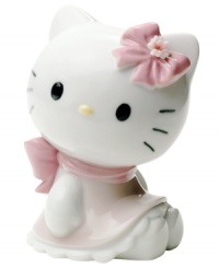 Wearing a pretty pink bow and scalloped dress, Hello Kitty is the essence of cute in this soon-to-be-cherished porcelain figurine from Nao by Lladro. Wearing a pretty pink bow and scalloped dress, Hello Kitty is the essence of cute in this soon-to-be-cherished porcelain figurine from Nao by Lladro.