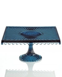 Past meets present. Feminine scalloped edges and fluted detail in sparkling blue glass make this Modern Vintage square cake stand a standout at the table and on display. From the Godinger serveware collection. Past meets present. Feminine scalloped edges and fluted detail in sparkling blue glass make this Modern Vintage square cake stand a standout at the table and on display. From the Godinger serveware collection.