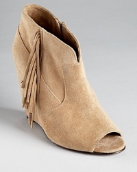 A peep toe bootie gets the fringe treatment on STEVEN BY STEVE MADDEN's soft suede Samaraa wedges. A peep toe bootie gets the fringe treatment on STEVEN BY STEVE MADDEN's soft suede Samaraa wedges.