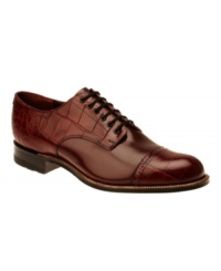 Featuring both smooth and croc-printed leather, this pair of cap toe oxford men's dress shoes offers a unique combination of textures and style. Featuring both smooth and croc-printed leather, this pair of cap toe oxford men's dress shoes offers a unique combination of textures and style.