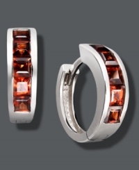 Ravishing in red. Baguette-cut garnets (2-1/10 ct. t.w.) add spice to a traditional pair of hoops. Crafted in sterling silver. Approximate diameter: 1/2 inch. Ravishing in red. Baguette-cut garnets (2-1/10 ct. t.w.) add spice to a traditional pair of hoops. Crafted in sterling silver. Approximate diameter: 1/2 inch.