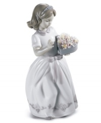 This little angel is poised to make a beautiful offering for someone special. Stands 9.75 tall. This little angel is poised to make a beautiful offering for someone special. Stands 9.75 tall.