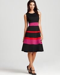 A swing skirt lends a ladylike look to this belted Anne Klein dress, detailed with punchy bands of colorful stripes. A swing skirt lends a ladylike look to this belted Anne Klein dress, detailed with punchy bands of colorful stripes.