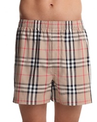 Hidden elastic waist band boxers with all over check pattern. One button fly. Hidden elastic waist band boxers with all over check pattern. One button fly.
