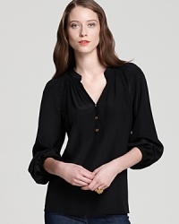 This Lilly Pulitzer top is as easy as a tee, but infinitely more chic as flowing silk inspires the effortless silhouette. This Lilly Pulitzer top is as easy as a tee, but infinitely more chic as flowing silk inspires the effortless silhouette.