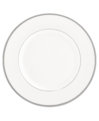 Lend a taste of glamor to any entree with the luminous Dentelle dinner plate. From innovative designer Monique Lhuillier, it features a platinum-edged tiered scallop pattern on creamy white.