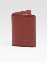 Bifold design crafted of rich Italian leather with topstitching and logo detail. Two card slots Two inside compartments ID window 3W X 4H Made in Italy Bifold design crafted of rich Italian leather with topstitching and logo detail. Two card slots Two inside compartments ID window 3W X 4H Made in Italy