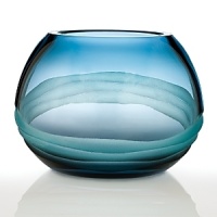 Featuring striking designs, dynamic shapes and dramatic color combinations – mouth blown and hand finished in the studios of Europe's foremost glass artisans – each Evolution piece is a one-of-a-kind example of high artistic vision, fashioned with expert technical dexterity and careful attention to detail from a vibrant palette of refined colors. Blending turquoise and purple to create a blissful shade of indigo, the Oasis collection is sure to infuse the home with a sense of calm, depth, and tranquility. Featuring striking designs, dynamic shapes and dramatic color combinations – mouth blown and hand finished in the studios of Europe's foremost glass artisans – each Evolution piece is a one-of-a-kind example of high artistic vision, fashioned with expert technical dexterity and careful attention to detail from a vibrant palette of refined colors. Blending turquoise and purple to create a blissful shade of indigo, the Oasis collection is sure to infuse the home with a sense of calm, depth, and tranquility.