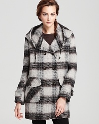 In classic plaid, this DKNY double-breasted coat with oversized pockets makes the perfect top layer to your winter-weekend looks. In classic plaid, this DKNY double-breasted coat with oversized pockets makes the perfect top layer to your winter-weekend looks.