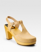 Buttery leather with cutouts and staple trim for an unexpected spin.Wooden heel, 3 (75mm) Wooden platform, ½(15mm) Compares to a 2½ heel (65mm) Leather lining Rubber sole Made in SwedenOUR FIT MODEL RECOMMENDS ordering true whole size; ½ sizes should order the next whole size up. 