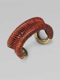 Supple leather wrapped around a cuff frame in a figure-eight design makes for a truly unique piece. LeatherAntique-finished brassDiameter, about 2Slip-on designImported Supple leather wrapped around a cuff frame in a figure-eight design makes for a truly unique piece. LeatherAntique-finished brassDiameter, about 2Slip-on designImported