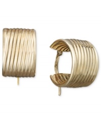 An absolute must-have for every girl's accessory collection. These stunning hoops feature a unique, ribbed design crafted in 14k gold. Approximate diameter: 3/8 inch.