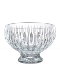 A series of vertical wedge cuts around the side of this lead crystal bowl create an effect of subtle radiance. Measuring 10 in diameter with a dramatic raised base. A series of vertical wedge cuts around the side of this lead crystal bowl create an effect of subtle radiance. Measuring 10 in diameter with a dramatic raised base.