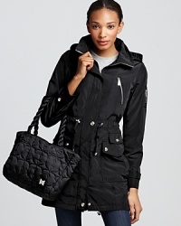 Beat the elements with this lightweight packable anorak from Dawn Levy. Exposed zippers and snap detailing lend modern edge. Beat the elements with this lightweight packable anorak from Dawn Levy. Exposed zippers and snap detailing lend modern edge.