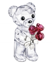 Already irresistible in faceted Swarovski crystal, this Kris Bear figurine extends a bouquet of red roses that'll win anyone's heart. Already irresistible in faceted Swarovski crystal, this Kris Bear figurine extends a bouquet of red roses that'll win anyone's heart.