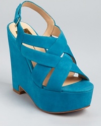 Constructed in soft suede with serious height, the Garren platform sandals from DV Dolce Vita aren't for the faint of heart. Pair them with black tights for a streamlined, leg-lengthening look. Constructed in soft suede with serious height, the Garren platform sandals from DV Dolce Vita aren't for the faint of heart. Pair them with black tights for a streamlined, leg-lengthening look.