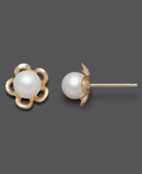 The perfect pair for your little flower child. These children's earrings feature cultured freshwater pearl (5-6 mm) studs with a cut-out flower design. Set in 14k gold. Approximate diameter: 1/3 inch. The perfect pair for your little flower child. These children's earrings feature cultured freshwater pearl (5-6 mm) studs with a cut-out flower design. Set in 14k gold. Approximate diameter: 1/3 inch.
