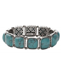 Naturally inspired. Fossil's reconstituted turquoise bracelet has an organic look and feel. Set in silver tone mixed metal with open back castings. Bracelet stretches to fit wrist. Approximate diameter: 2-1/4 inches. Naturally inspired. Fossil's reconstituted turquoise bracelet has an organic look and feel. Set in silver tone mixed metal with open back castings. Bracelet stretches to fit wrist. Approximate diameter: 2-1/4 inches.