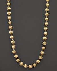 Hand engraved beaded necklace in 18K yellow gold from Marco Bicego's Africa collection. Hand engraved beaded necklace in 18K yellow gold from Marco Bicego's Africa collection.