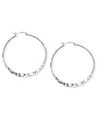 Classic hoops with an extra kick. Earrings have been hammered for a rustic, textured look. Flat sterling silver setting. Approximate diameter: 1-1/3 inches. Classic hoops with an extra kick. Earrings have been hammered for a rustic, textured look. Flat sterling silver setting. Approximate diameter: 1-1/3 inches.