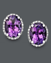 Pair your ensemble with a perfect touch of purple. These regal-looking stud earrings feature bright oval-cut amethyst (3 ct. t.w.) surrounded by a pretty ring of round-cut diamond (1/8 ct. t.w.). Crafted in 14k white gold. Approximate diameter: 1/2 inch. Pair your ensemble with a perfect touch of purple. These regal-looking stud earrings feature bright oval-cut amethyst (3 ct. t.w.) surrounded by a pretty ring of round-cut diamond (1/8 ct. t.w.). Crafted in 14k white gold. Approximate diameter: 1/2 inch.