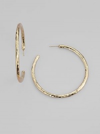 Simple hoops become simply sensational when crafted with a rich hammered texture. 18k yellow gold Diameter, about 2 Post back Imported Simple hoops become simply sensational when crafted with a rich hammered texture. 18k yellow gold Diameter, about 2 Post back Imported
