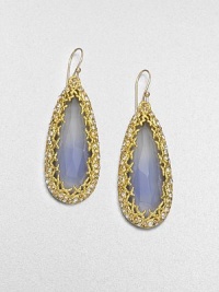 From the Elements Siyabona Collection. A subtly hued faceted oval of painted white quartz is fabulously framed by an X-motif setting of pebble-textured goldtone dotted with the sparkle of Swarovski crystals.Painted white quartzCrystalGoldtoneDrop, about 2.25Width, about .75Ear wireMade in USA From the Elements Siyabona Collection. A subtly hued faceted oval of painted white quartz is fabulously framed by an X-motif setting of pebble-textured goldtone dotted with the sparkle of Swarovski crystals.Painted white quartzCrystalGoldtoneDrop, about 2.25Width, about .75Ear wireMade in USA