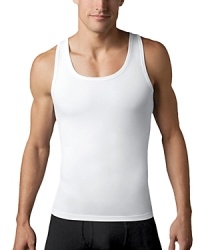 Gentlemen, expect more from your undershirt! This cotton compression tank top will forever change the way you look and feel in your clothes. Made with high-quality, ring-spun cotton, this tank leaves no bulk under clothes. Gentlemen, expect more from your undershirt! This cotton compression tank top will forever change the way you look and feel in your clothes. Made with high-quality, ring-spun cotton, this tank leaves no bulk under clothes.