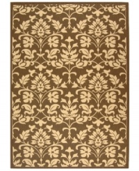 Safavieh takes classic beauty outside of the home with this elegant rug, created with a specially designed sisal weave. In deep chocolate brown with natural accents, this beautiful piece makes the most of any outdoor patio, porch or balcony. (Clearance)