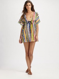 A glamorous swim coverup featuring multiple eye-catching hues and a nautical-inspired cord detail at its Empire waist. V-necklineFlutter sleevesDrawstring cord at Empire waist60% cotton/40% silkDry cleanMade in USA A glamorous swim coverup featuring multiple eye-catching hues and a nautical-inspired cord detail at its Empire waist. V-necklineFlutter sleevesDrawstring cord at Empire waist60% cotton/40% silkDry cleanMade in USA
