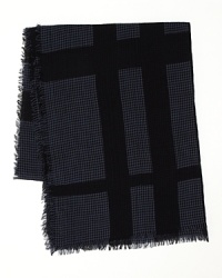 A lightweight scarf with Burberry's iconic check pattern is offset with classic houndstooth for a posh addition to your stylish ensemble. A lightweight scarf with Burberry's iconic check pattern is offset with classic houndstooth for a posh addition to your stylish ensemble.