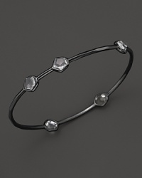 A modern sterling silver bangle with clear quartz stations from Ippolita. A modern sterling silver bangle with clear quartz stations from Ippolita.