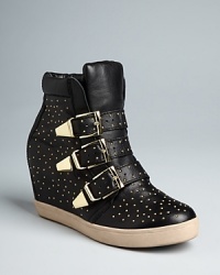 STEVEN BY STEVE MADDEN keeps up with the pack following the fashion sneaker trend with these stylish wedge booties. Golden studs and gleaming buckles make this look medal-worthy. STEVEN BY STEVE MADDEN keeps up with the pack following the fashion sneaker trend with these stylish wedge booties. Golden studs and gleaming buckles make this look medal-worthy.