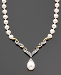 A pièce de résistance; this stunning necklace features cultured freshwater pearls (8-10 mm) and round-cut diamonds (1/10 ct. t.w) set in 14k gold and sterling silver. Approximate length: 17 inches. Approximate drop: 1-1/2 inches. A pièce de résistance; this stunning necklace features cultured freshwater pearls (8-10 mm) and round-cut diamonds (1/10 ct. t.w) set in 14k gold and sterling silver. Approximate length: 17 inches. Approximate drop: 1-1/2 inches.