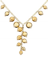 Glowing, gilded style. Spice up your daily look with this necklace crafted in brushed and polished 14k gold and sterling silver over sterling silver. Approximate length: 18 inches. Approximate drop: 3 inches.