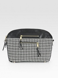 Graphic houndstooth fabric with leather trim and goldtone hardware.Top zip closureProtective metal feetTwo outside zip pocketsTwo inside open pocketsCotton lining14½W X 10½H X 3¼DMade in Italy Graphic houndstooth fabric with leather trim and goldtone hardware.Top zip closureProtective metal feetTwo outside zip pocketsTwo inside open pocketsCotton lining14½W X 10½H X 3¼DMade in Italy