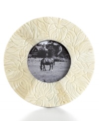 Engraved bone adds warmth and exotic flair to your favorite images of loved ones. Also, the neutral color of this classic Purva frame beautifully compliments many interior designs, making it a beautiful gift for many occasions.