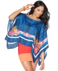 In an on-trend poncho style, this BCBGMAXAZRIA floral & python printed top is perfect for a bold spring look! In an on-trend poncho style, this BCBGMAXAZRIA floral & python printed top is perfect for a bold spring look!
