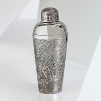 The grand form of a mythical dragon was the muse behind this sculptural cocktail shaker from Natori. It's artfully cast to capture a rich reptile-inspired texture. The grand form of a mythical dragon was the muse behind this sculptural cocktail shaker from Natori. It's artfully cast to capture a rich reptile-inspired texture.